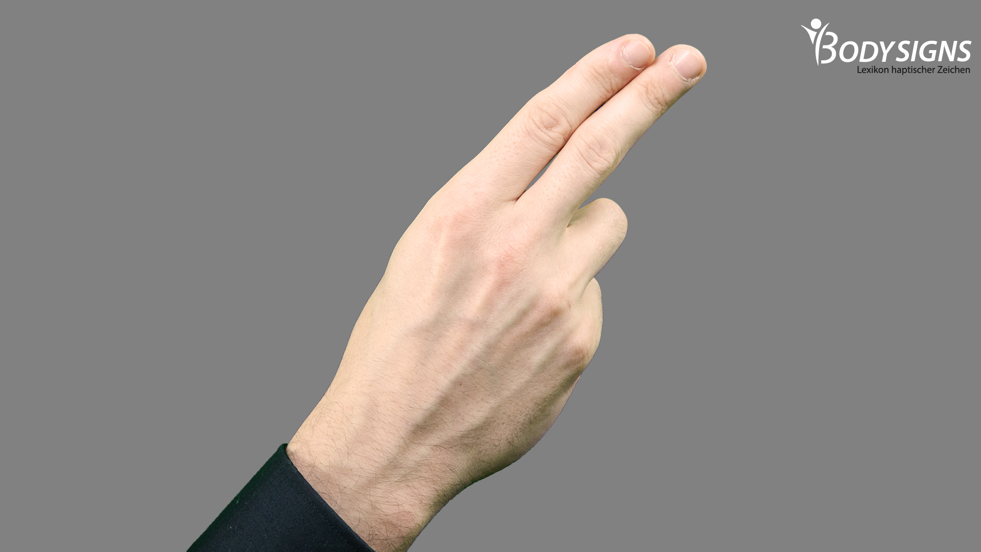 Zeigefinger und Mittelfinger ausgestreckt und eng beieinander.